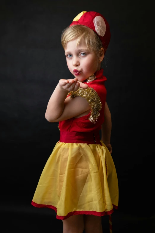 a  in red and yellow dress with big eyes