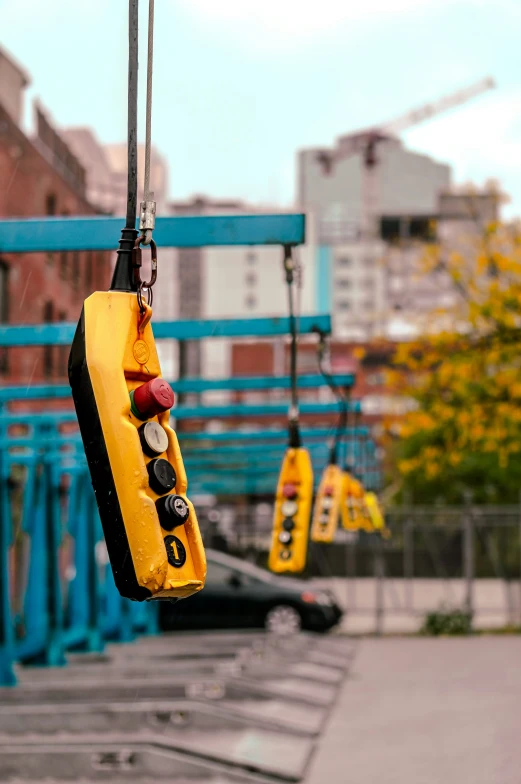 a close up of a yellow object attached to a wire