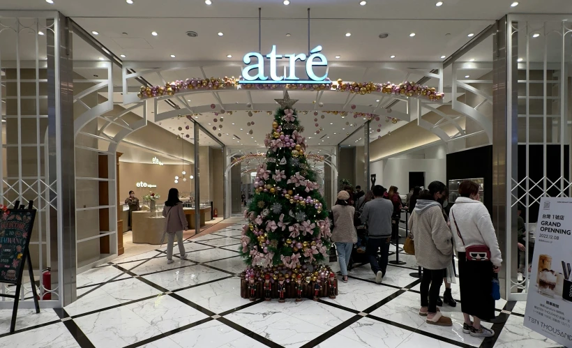 a christmas tree on display in an area that looks like a mall