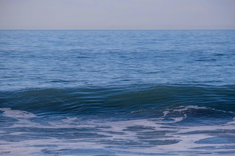 there is a person riding a surfboard in the water