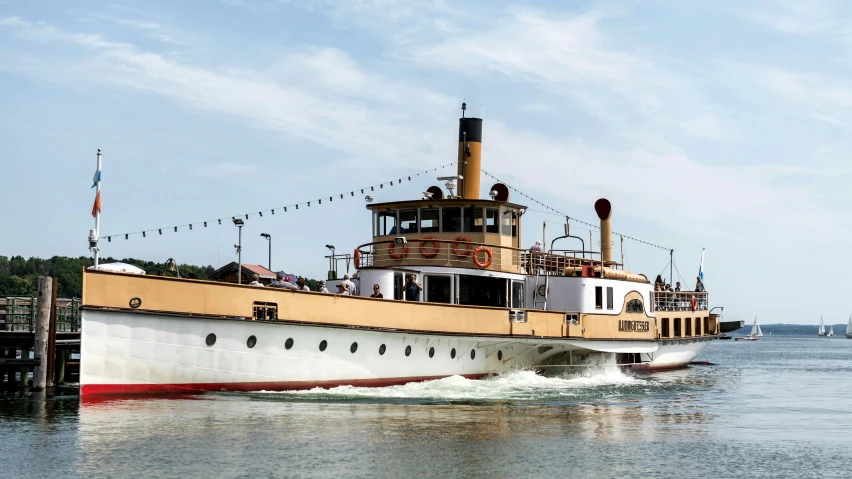 a boat traveling down the river during the day