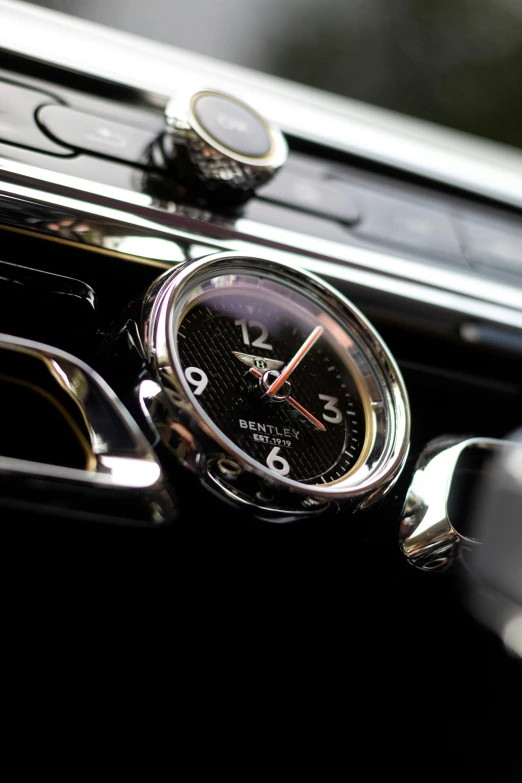 the inside of a car with a clock on the inside