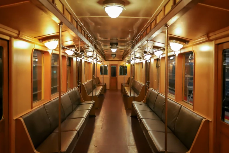 an empty train car with two seats facing the wall