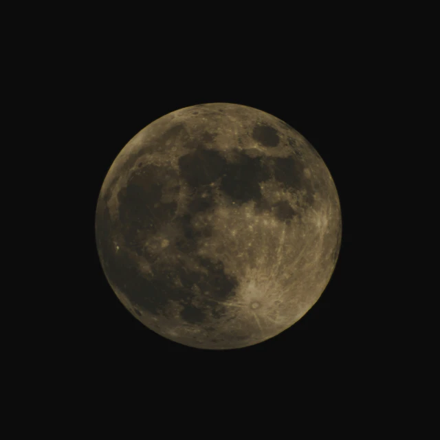 the full moon is seen at night in the sky