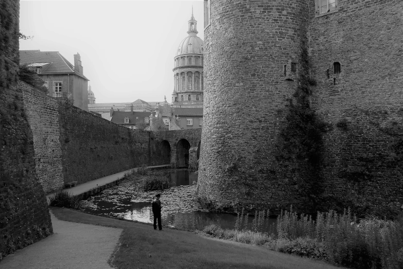 black and white pograph of people in old buildings