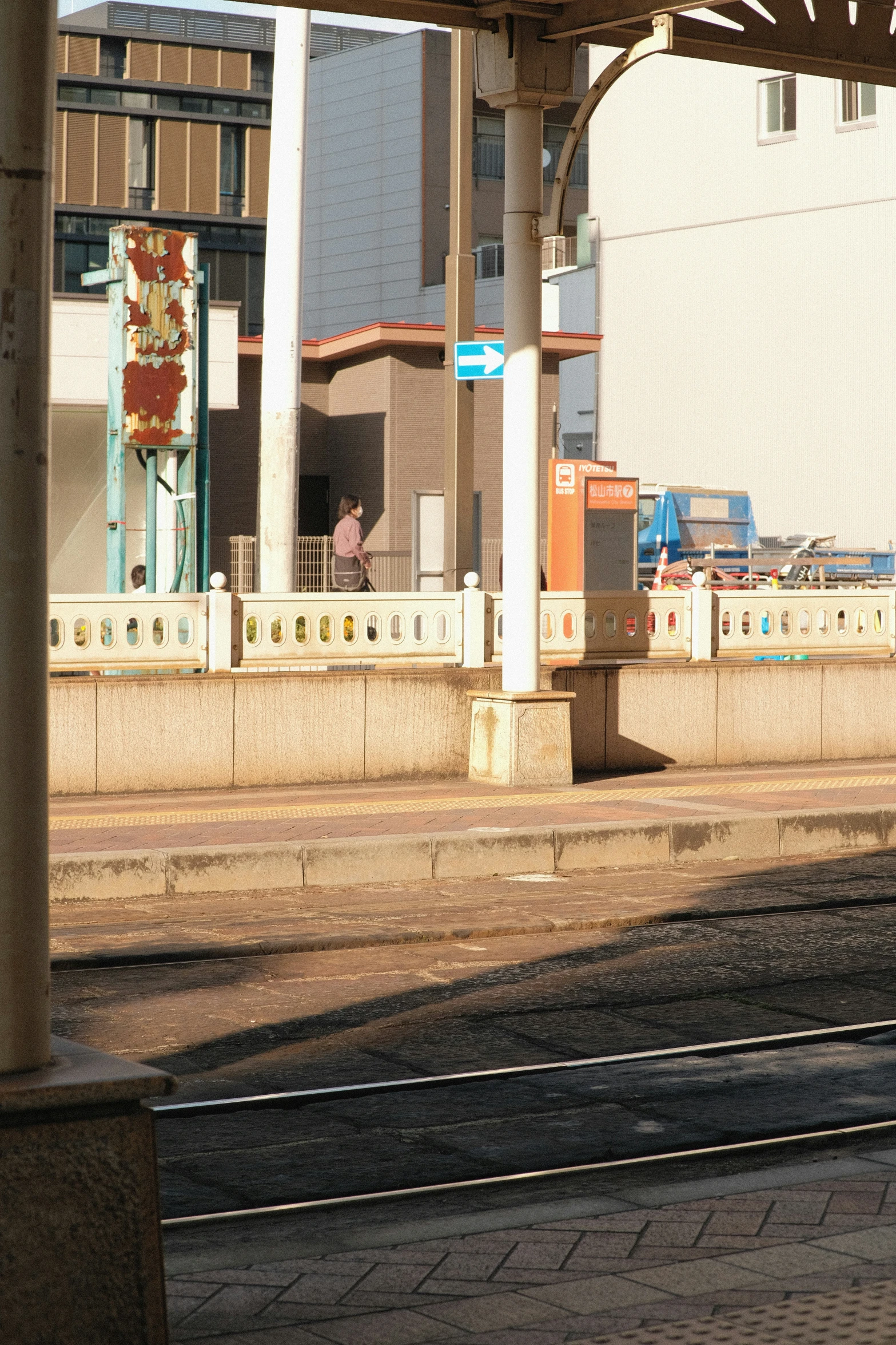 a railroad track going through an empty train station