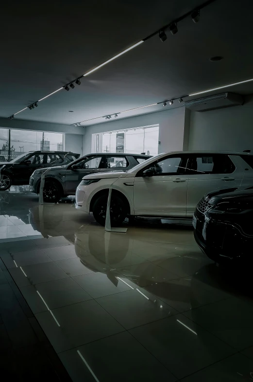 an assortment of different suvs displayed in a large car showroom