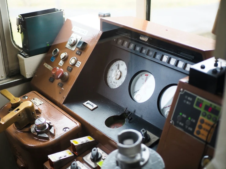 the control panel inside a small boat on a river