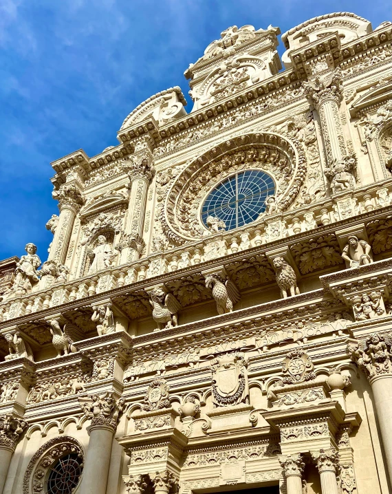 a large old building has a blue clock on top