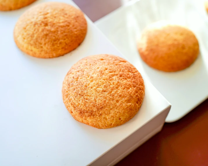 cookies sitting on top of white cardboard