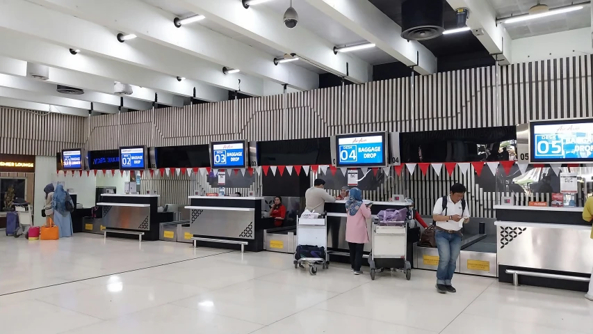 a group of people sitting at a terminal