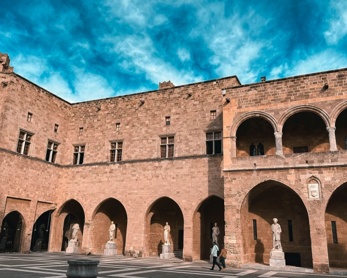 a tall building with arches and pillars