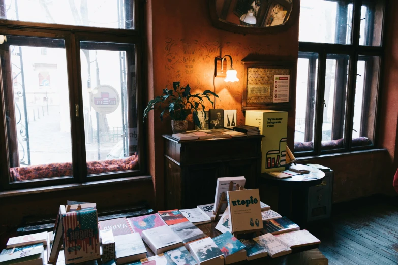 books and magazines are on display by the window