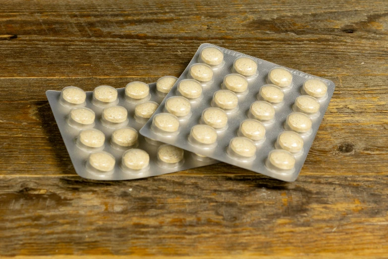 two packets of contraption pills sit on a table