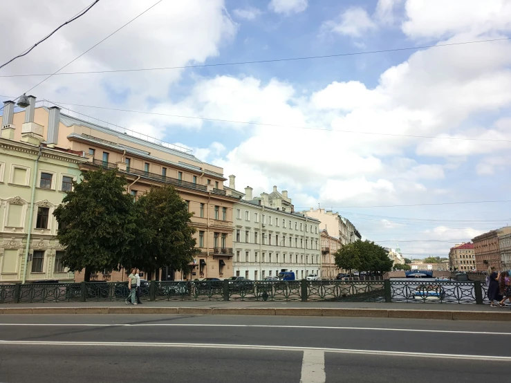 a road with lots of buildings and trees on the side of it