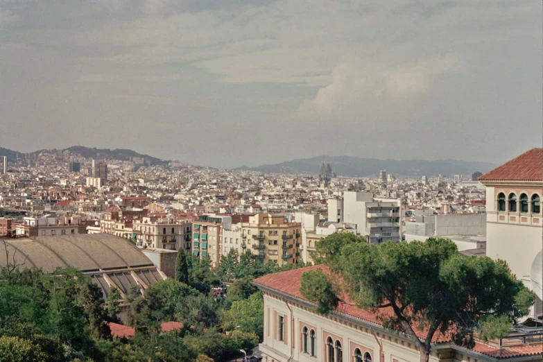 a large city is covered with buildings and trees