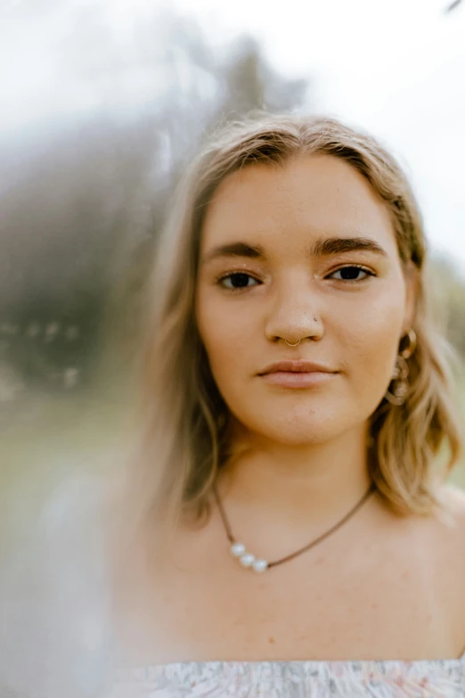 a girl with blue eyes stares directly into the camera