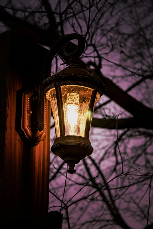 a light that is attached to a wall in a city