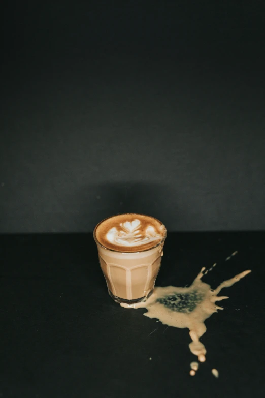 coffee drink with liquid floating out of the cup