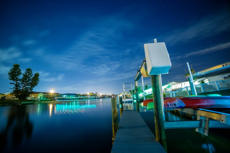 a body of water with several docks and buildings near the water