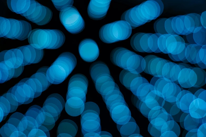 an abstract po of bright blue circles of light