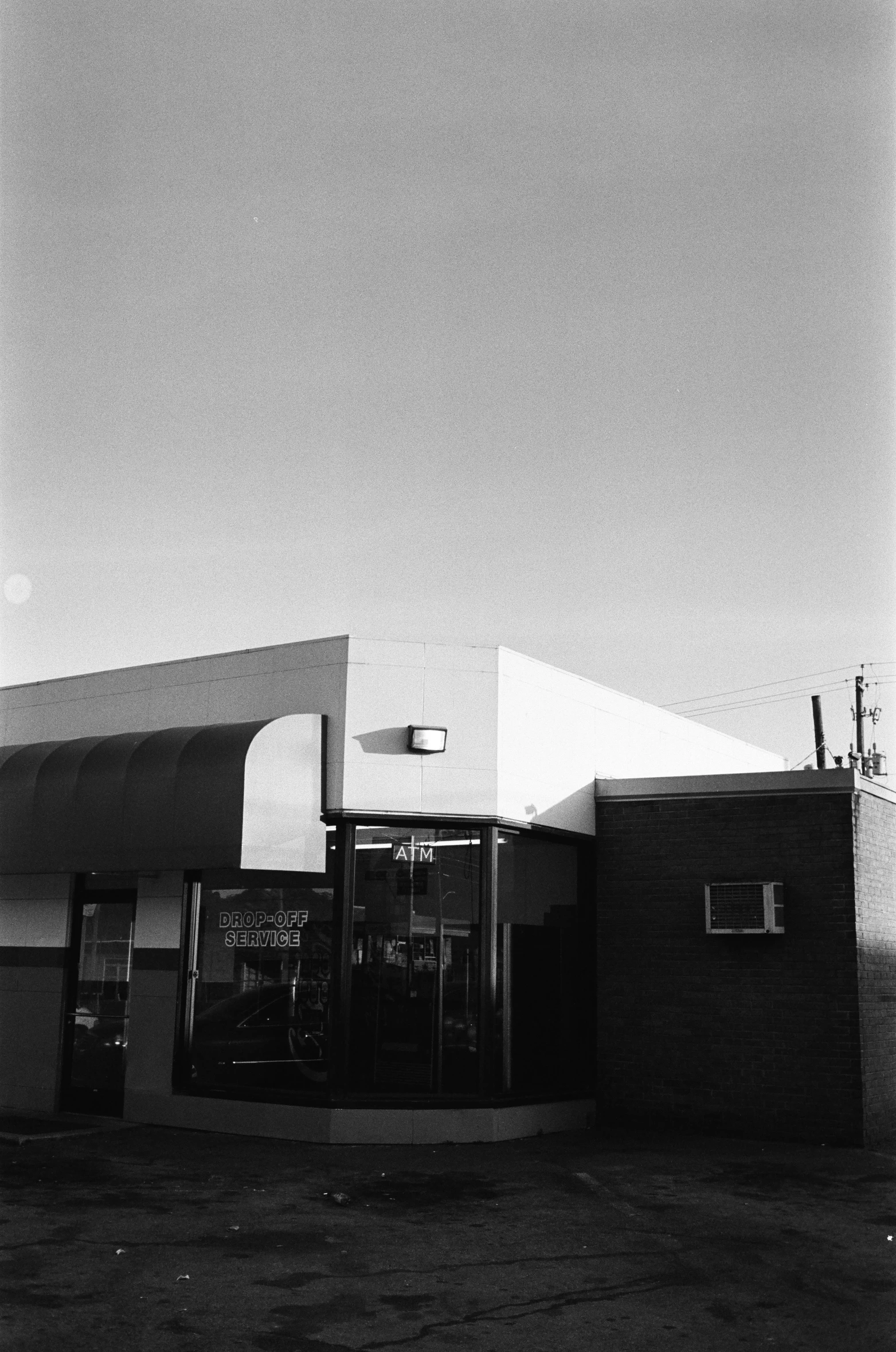 this is an image of a gas station in black and white