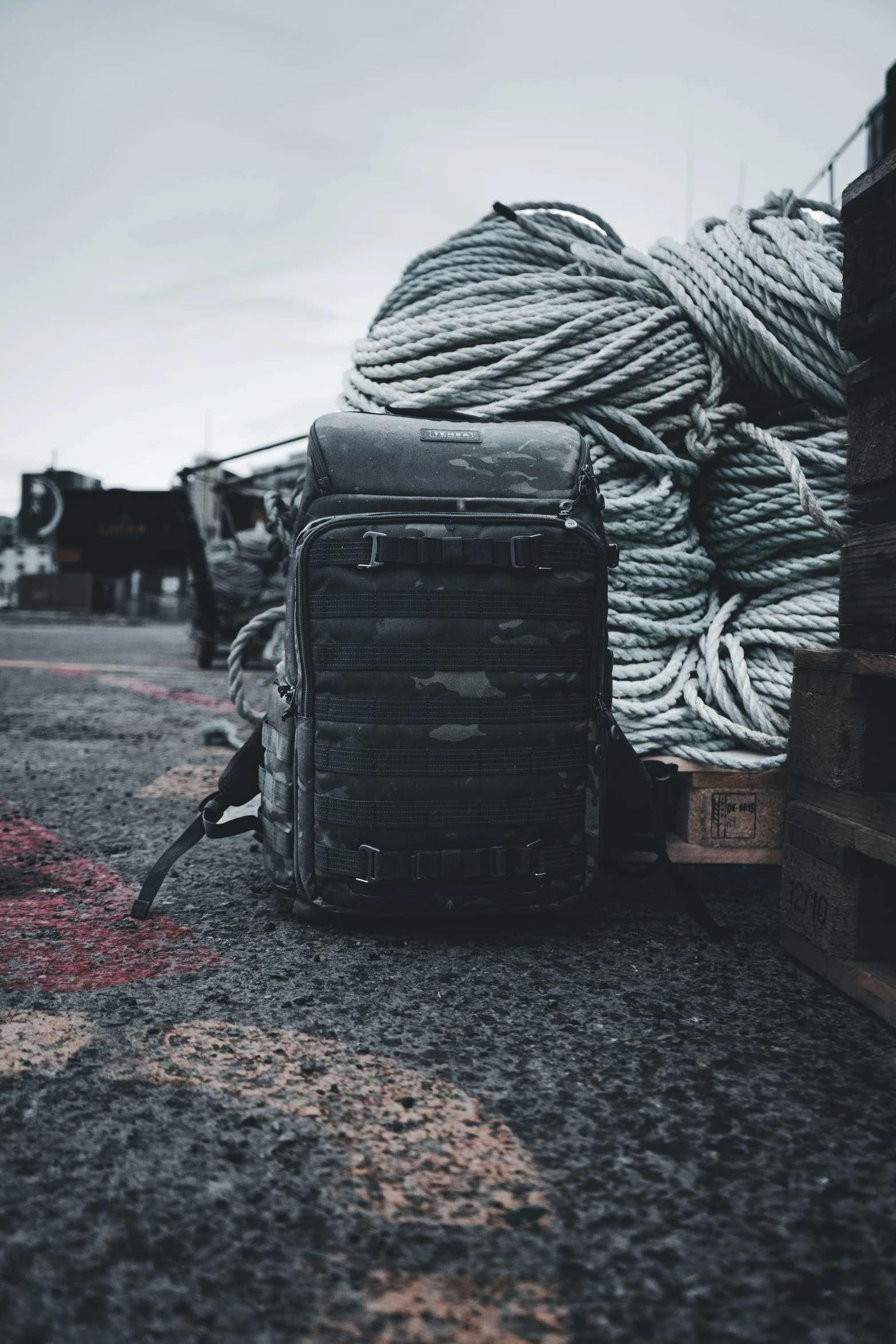 an old suitcase and yarn pile on the ground