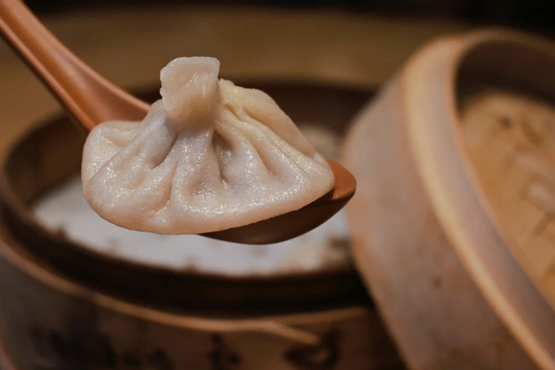 an image of dumplings in a wooden container