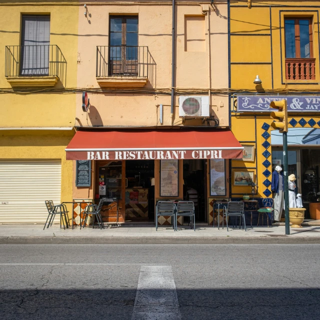 the storefront of an upscale restaurant on a quiet city street