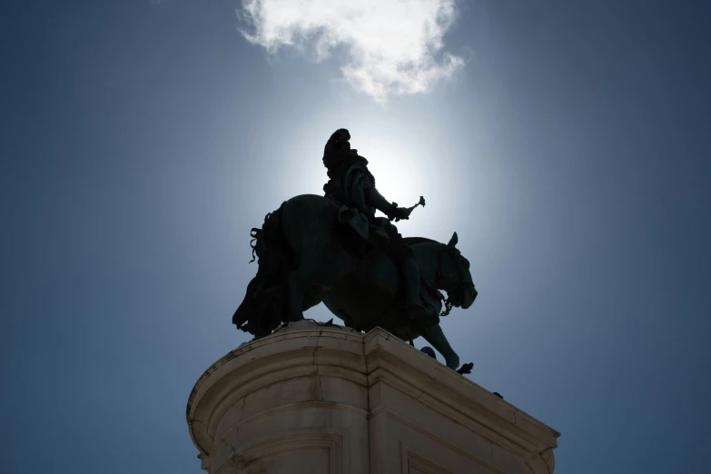 a large statue sitting on the top of a horse