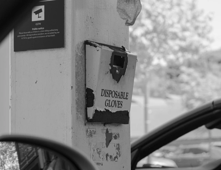 a close up of an old parking meter with the words impossible clothes on it