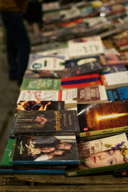 a table that has several different books on it