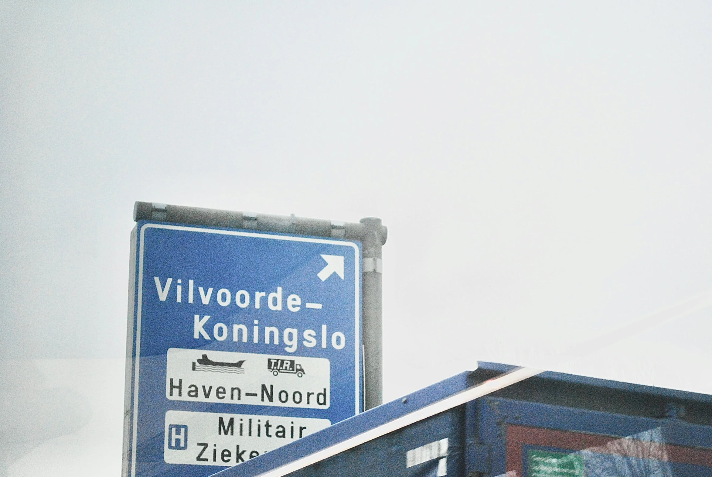 street signs are shown with a sky background