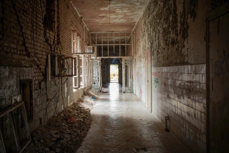 an empty building with brick walls and a door