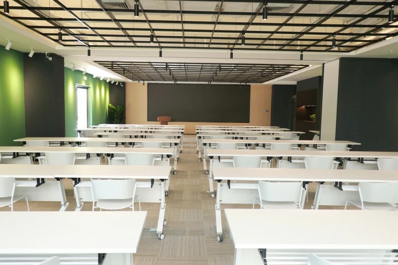 tables and chairs are lined up against the wall