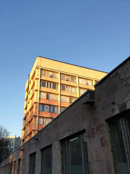 a long building next to windows in the sky