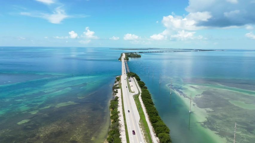 a view of the highway next to an island and lagoon