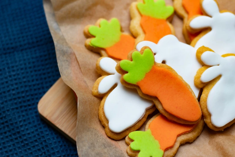 a table with decorated cookies and other treats on it