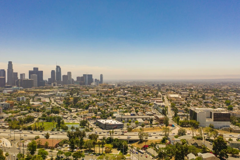 an aerial view of the city with high rise buildings