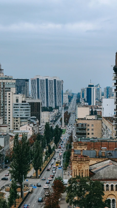 city buildings in the distance and lots of traffic on the street