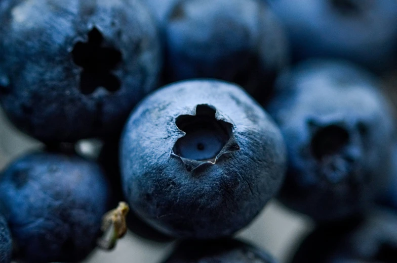 blueberries with the middle cut open sitting on top of a table