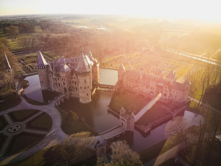 an aerial view of an castle like building in the sun