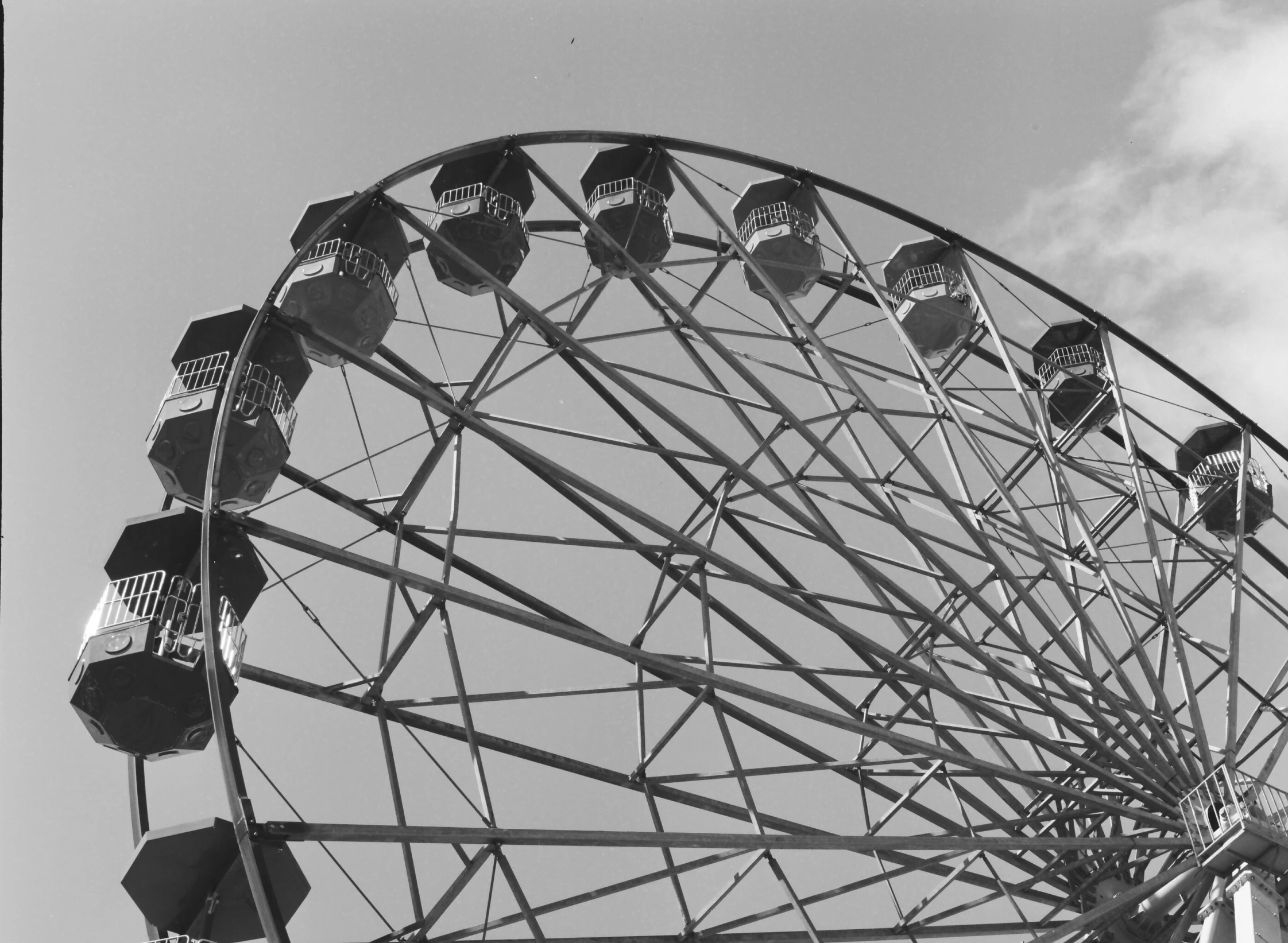 a black and white image of a large ferris wheel