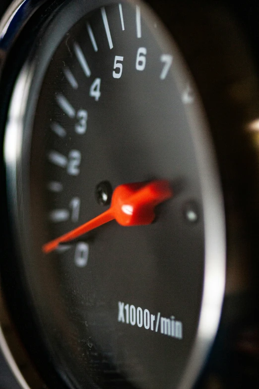 a black gauge on a motorcycle shows the current speed