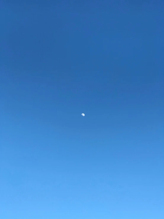 a large airplane flying in a clear sky