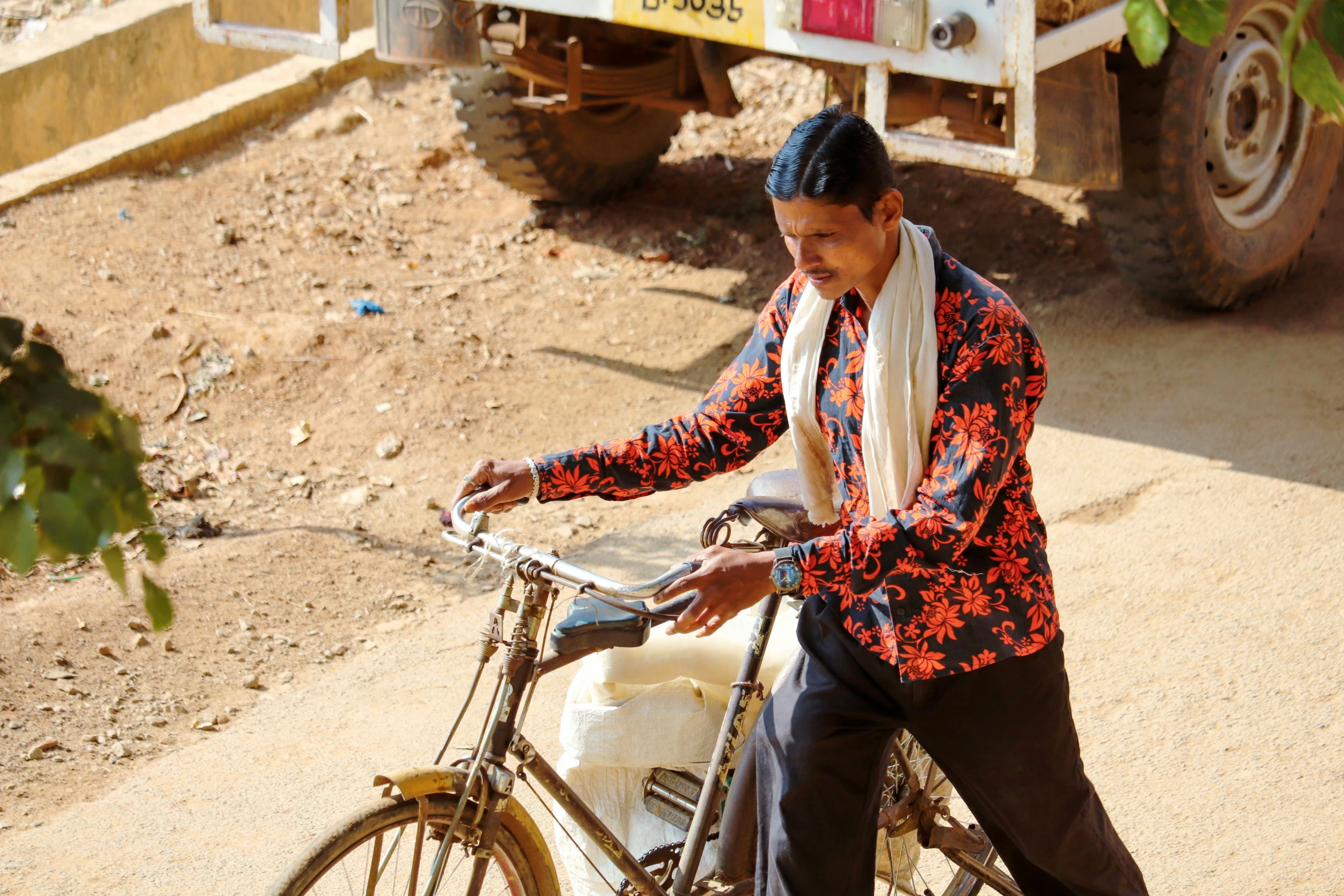 a man with blue hair on top of a bike