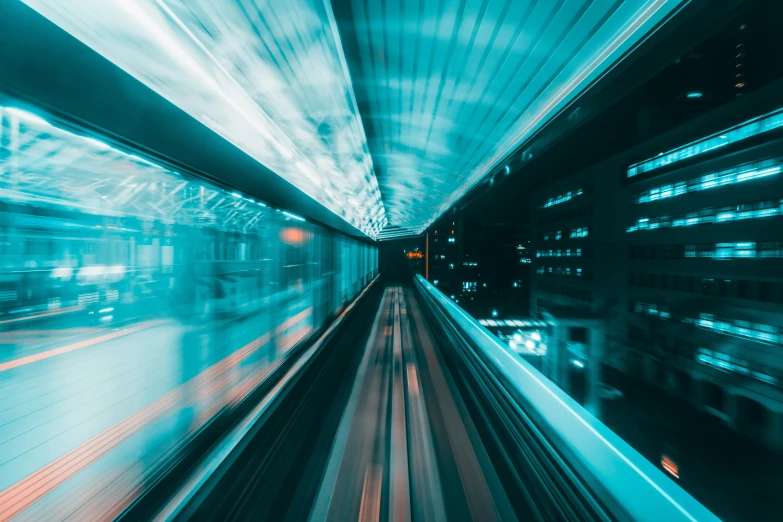 a train moving fast down the tracks in a tunnel