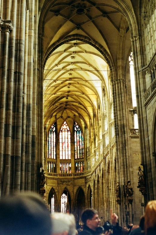 the interior of a cathedral with large stained glass windows