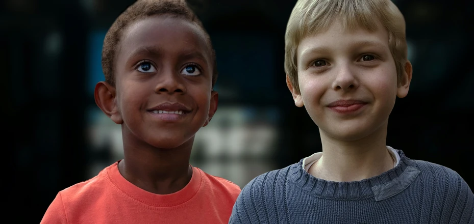the boy with his friend are both identical
