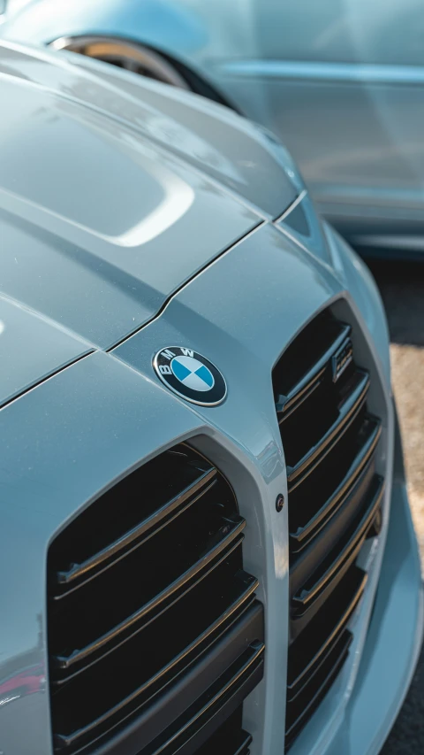 close up of the front grill and grille of a silver car